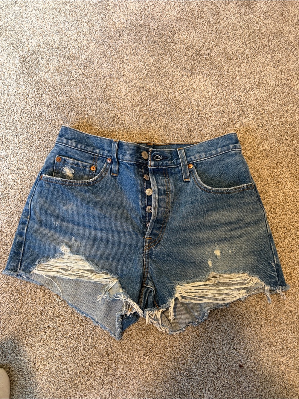 High-Rise Distressed Denim Shorts in Blue